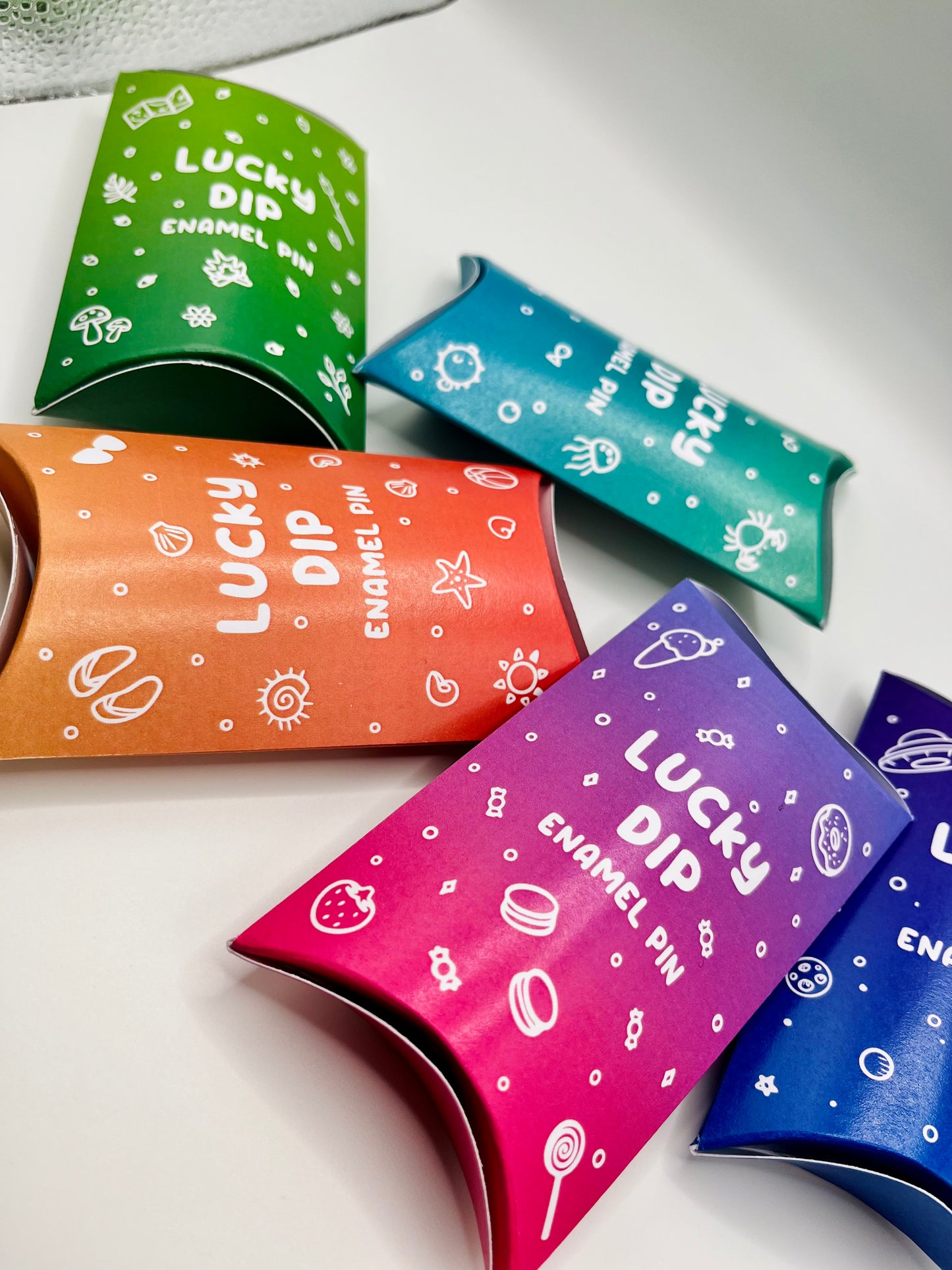 Foxti lucky dip mystery enamel pin in eco recycled card packaging