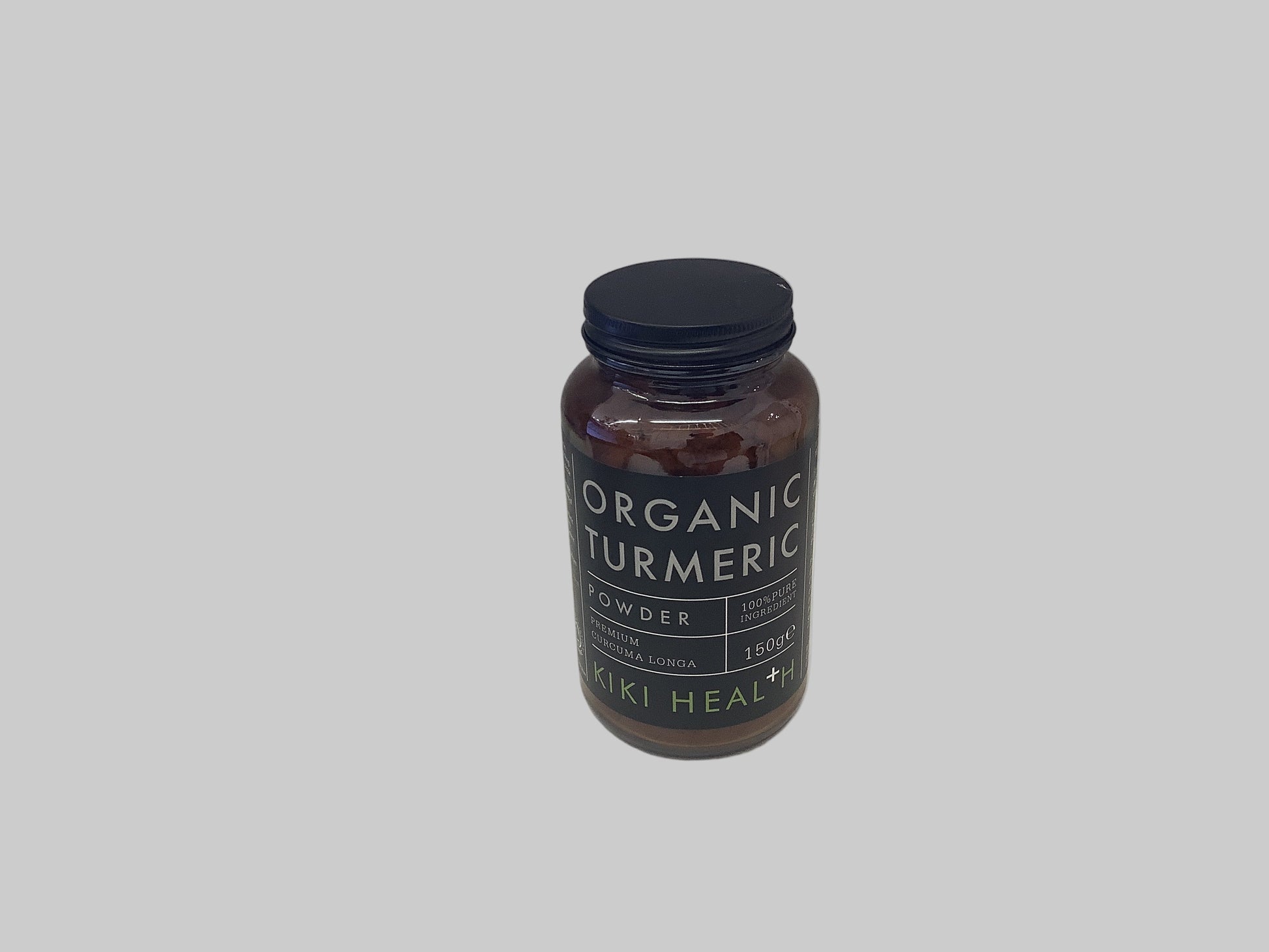 Bottle of Organic Turmeric Powder by KIKI Health on a white surface.