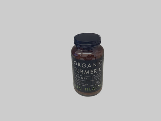 Bottle of Organic Turmeric Powder by KIKI Health on a white surface.