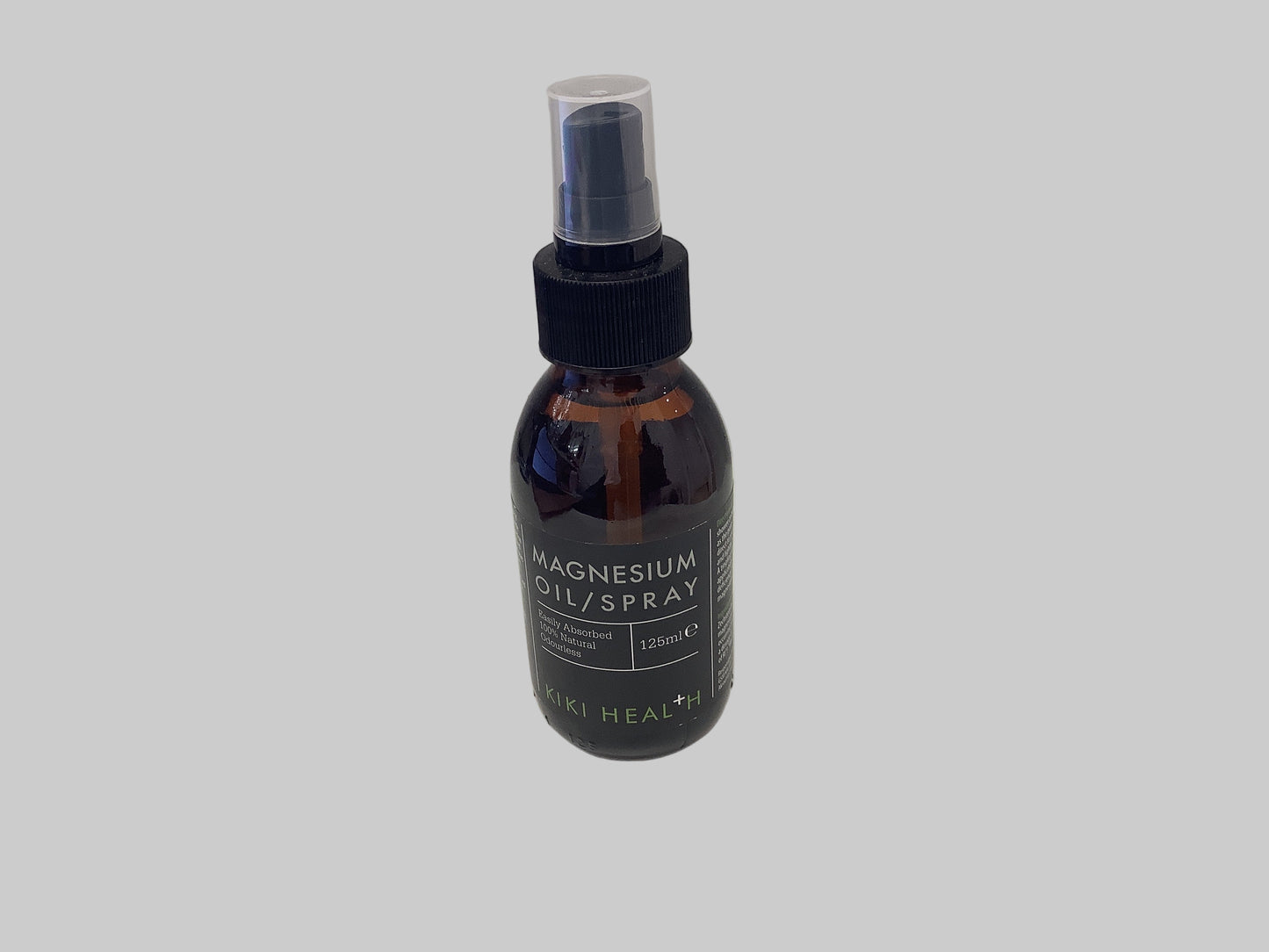 Bottle of magnesium oil/spray on a white surface