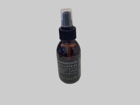 Bottle of magnesium oil/spray on a white surface