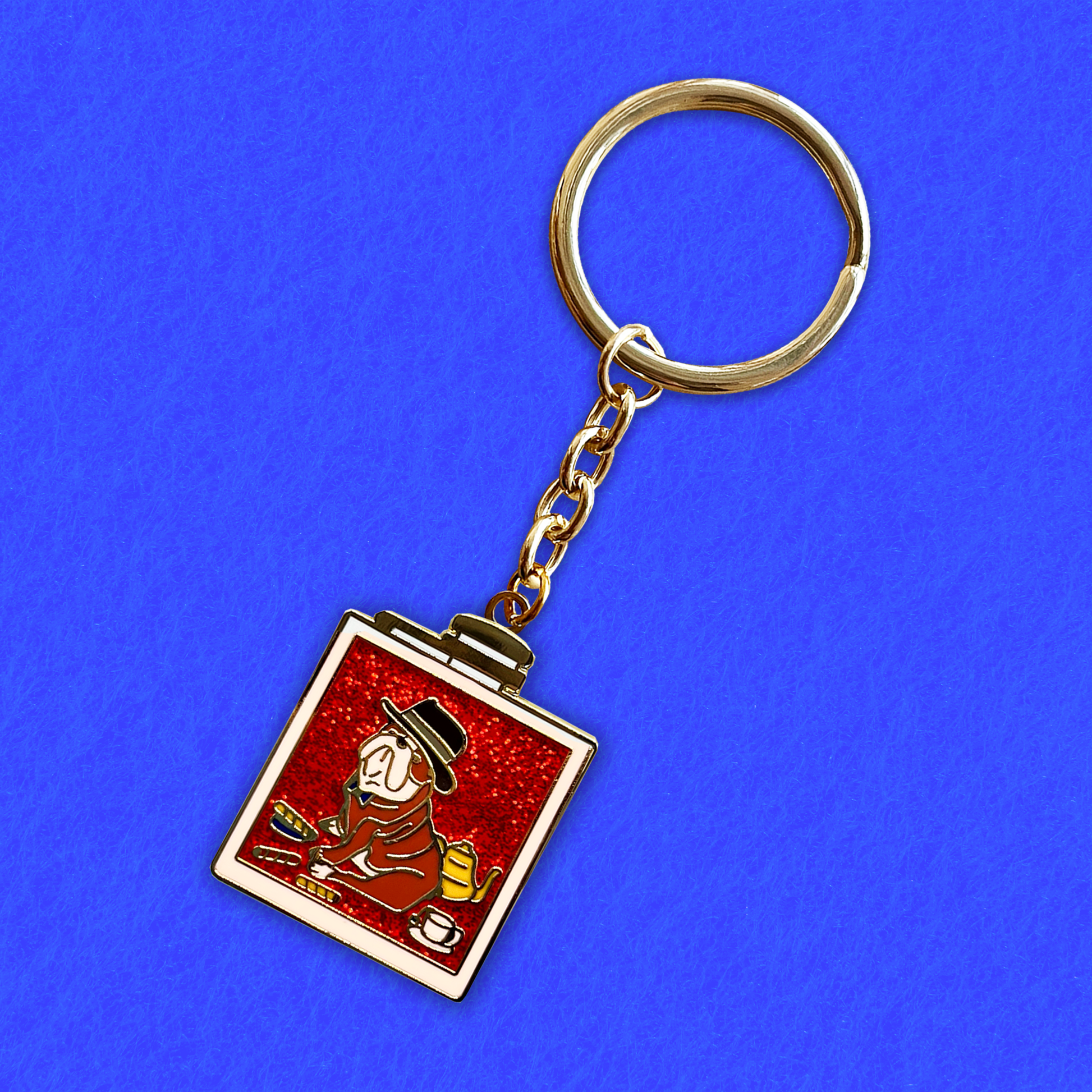 Foxti illustrated keyring with gold-plated chain on premium recycled card packaging