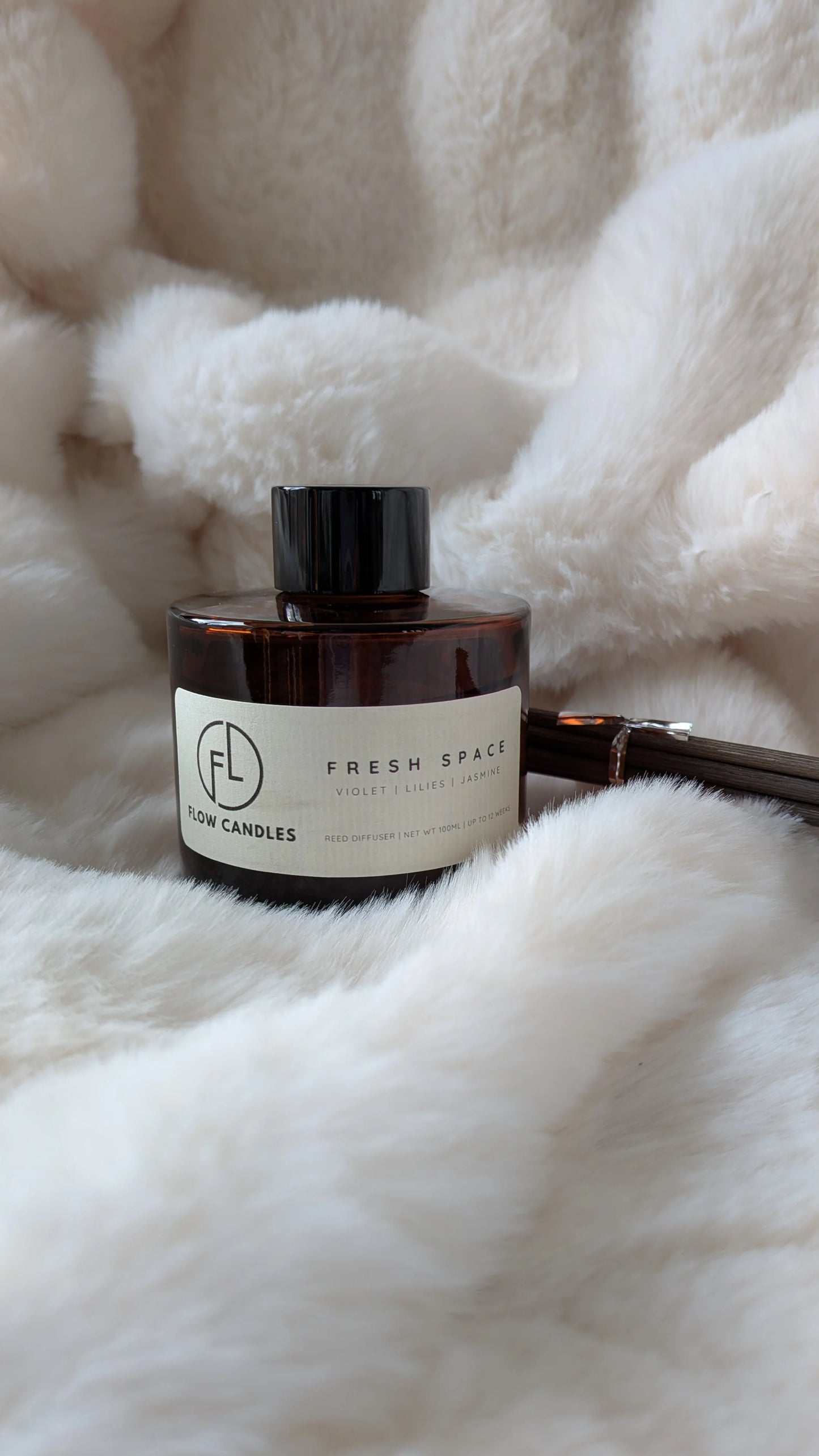 Flow Candles luxury reed diffuser - elegant home fragrance in premium glass bottle