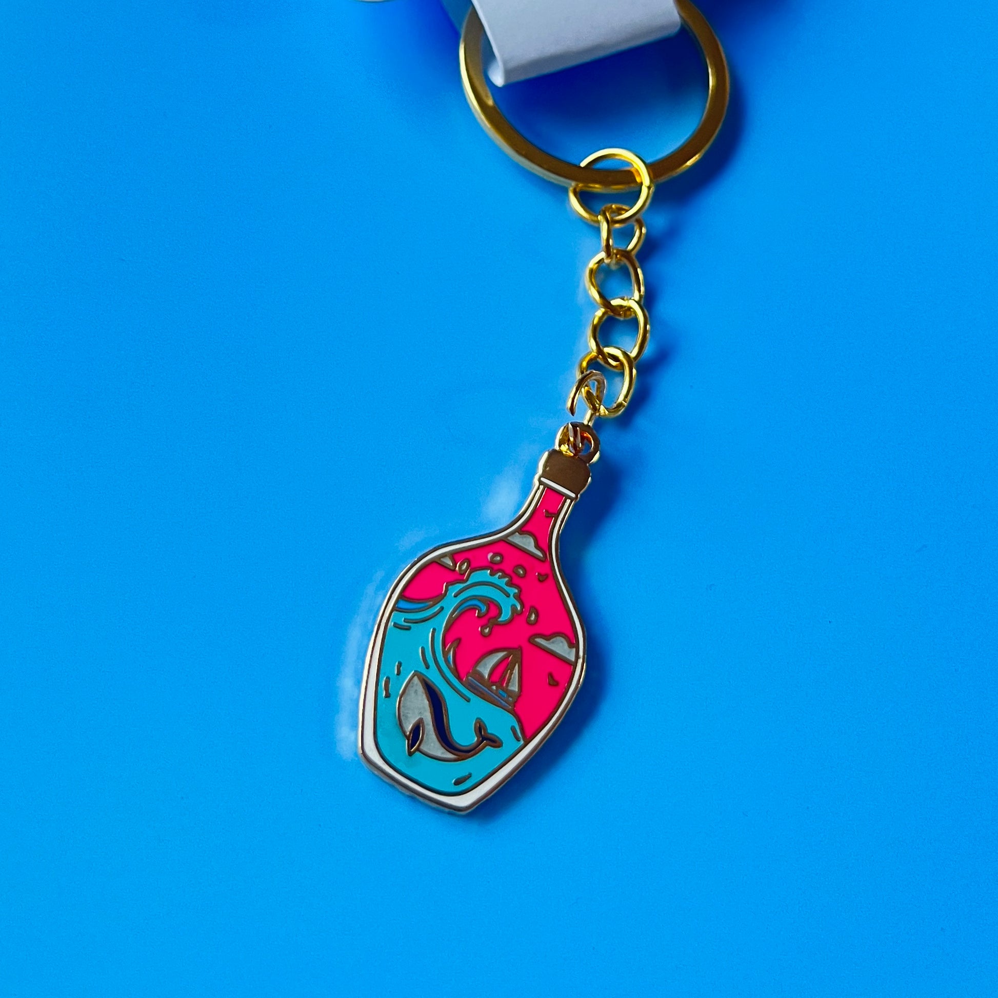 Foxti illustrated keyring with gold-plated chain on premium recycled card packaging