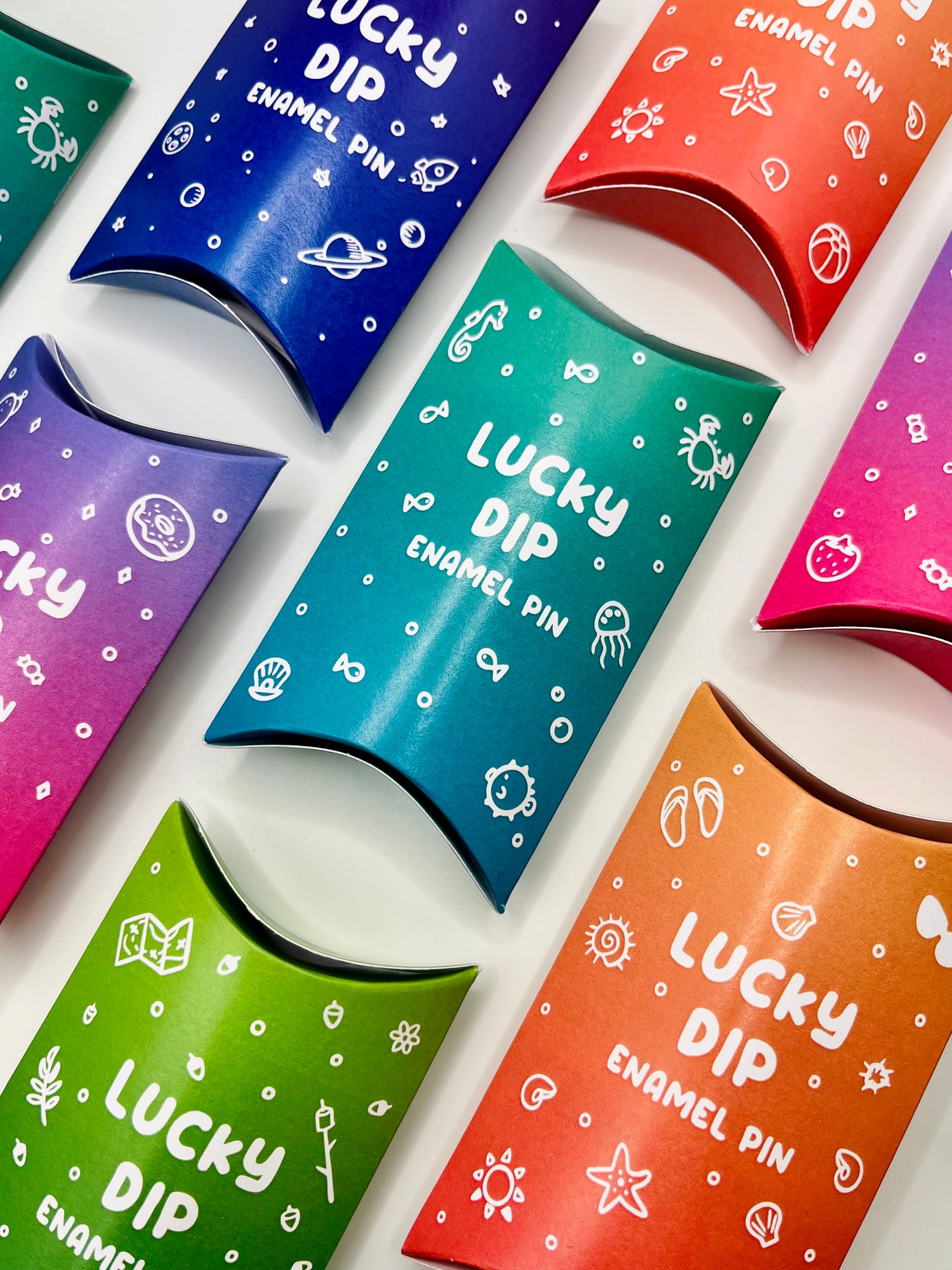Foxti lucky dip mystery enamel pin in eco recycled card packaging