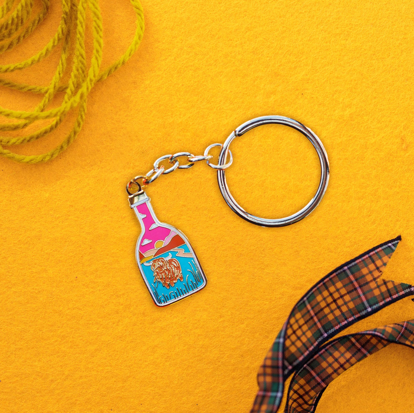 Foxti illustrated keyring with gold-plated chain on premium recycled card packaging