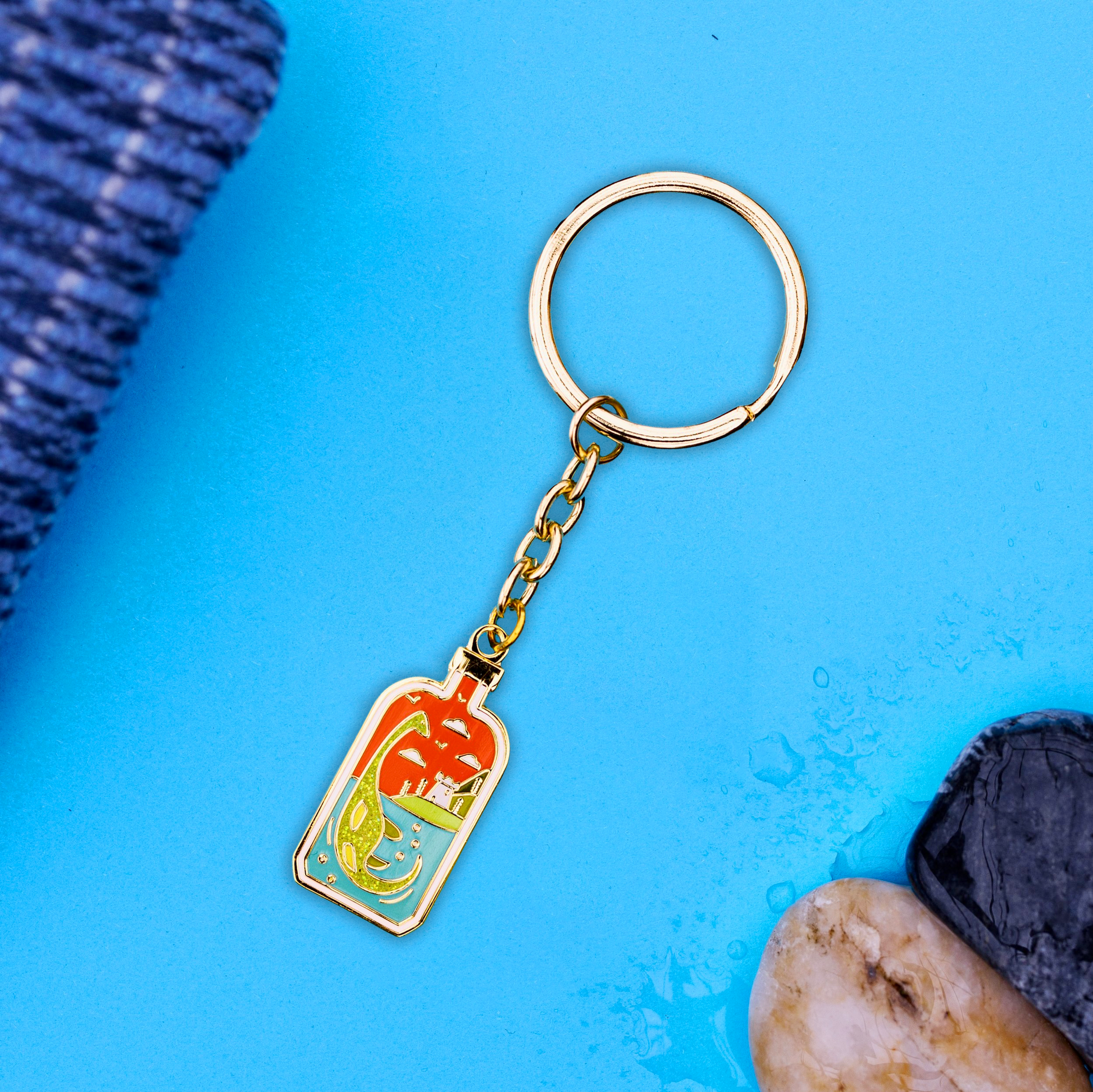 Foxti illustrated keyring with gold-plated chain on premium recycled card packaging
