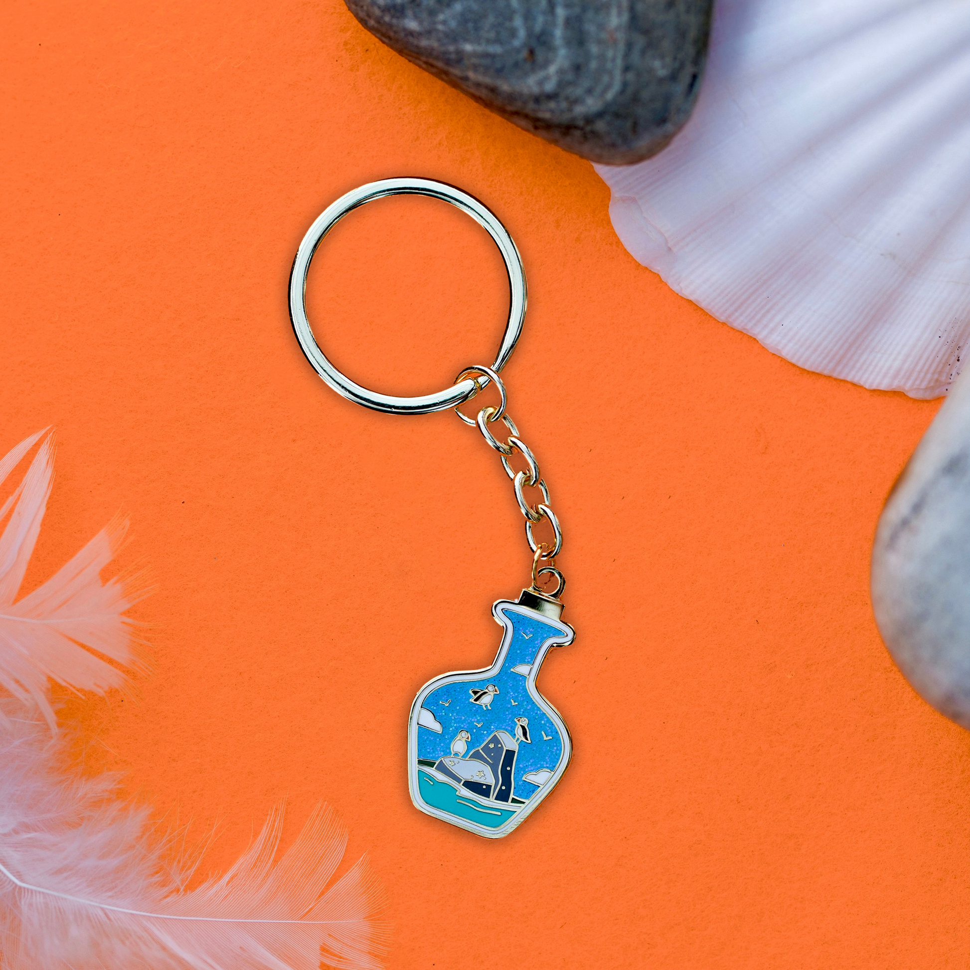 Foxti illustrated keyring with gold-plated chain on premium recycled card packaging