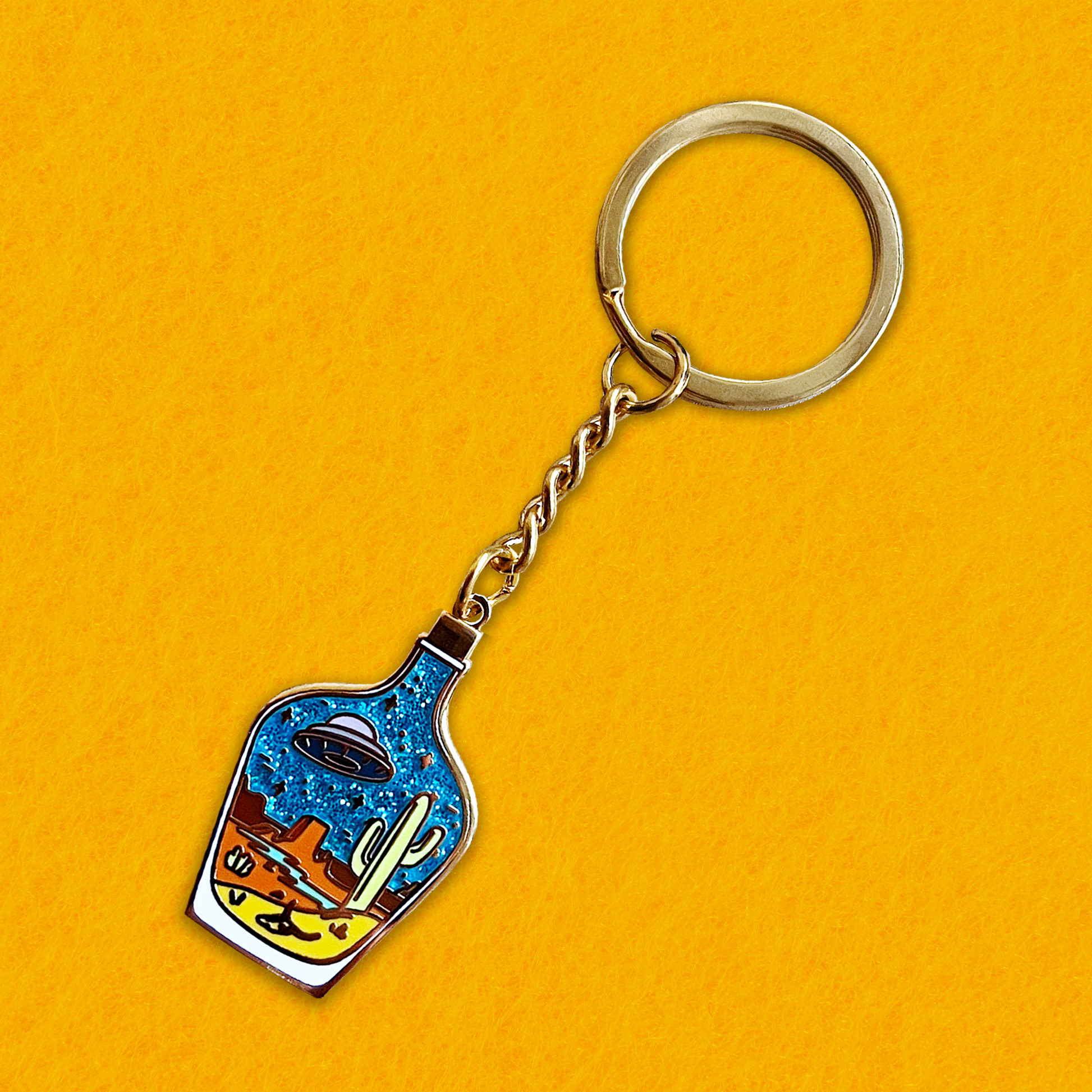 Foxti illustrated keyring with gold-plated chain on premium recycled card packaging